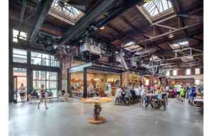 Armature Works interior food hall with high ceilings dining people