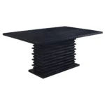 A close-up, angled shot of the layered pedestal base of the black dining table, highlighting its unique artistic texture.