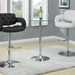 Two Brandi Adjustable Bar Stools (Black and White) with Chrome Bases and a Bar Table in a Modern Dining Room