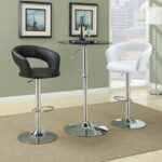 Pair of Modern Adjustable Bar Stools (Black and White) with Chrome Bases and a Black Pedestal Bar Table in a Contemporary Room