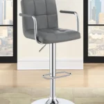 Palomar Adjustable Height Bar Stool in Grey Faux Leather with Tufted Back, Armrests, and Chrome Pedestal Base in the room