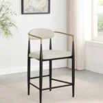 Modern Beige Counter Stool with Black Frame and Gold Armrests in the room