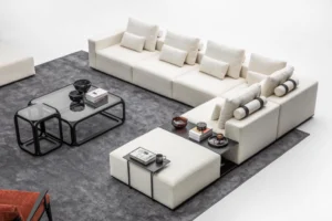 Modern L-shaped modular sectional sofa in light beige fabric with plush cushions