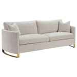 Corliss beige velvet sofa with gold legs and curved arms