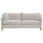 Corliss beige velvet sofa with gold legs and curved arms