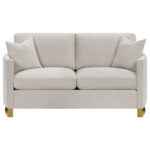 Corliss beige velvet loveseat with curved arms and gold legs