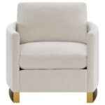 Corliss beige velvet accent armchair with curved arms and gold legs