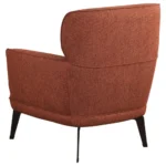 Back three-quarter view of the orange modern chair showing the cushioned backrest.