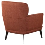 Full back view of the orange upholstered chair.