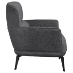 Close-up side view of the Andrea grey accent chair's crescent arm and black leg.