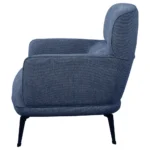 Side profile of the blue arm chair showing its crescent arm.