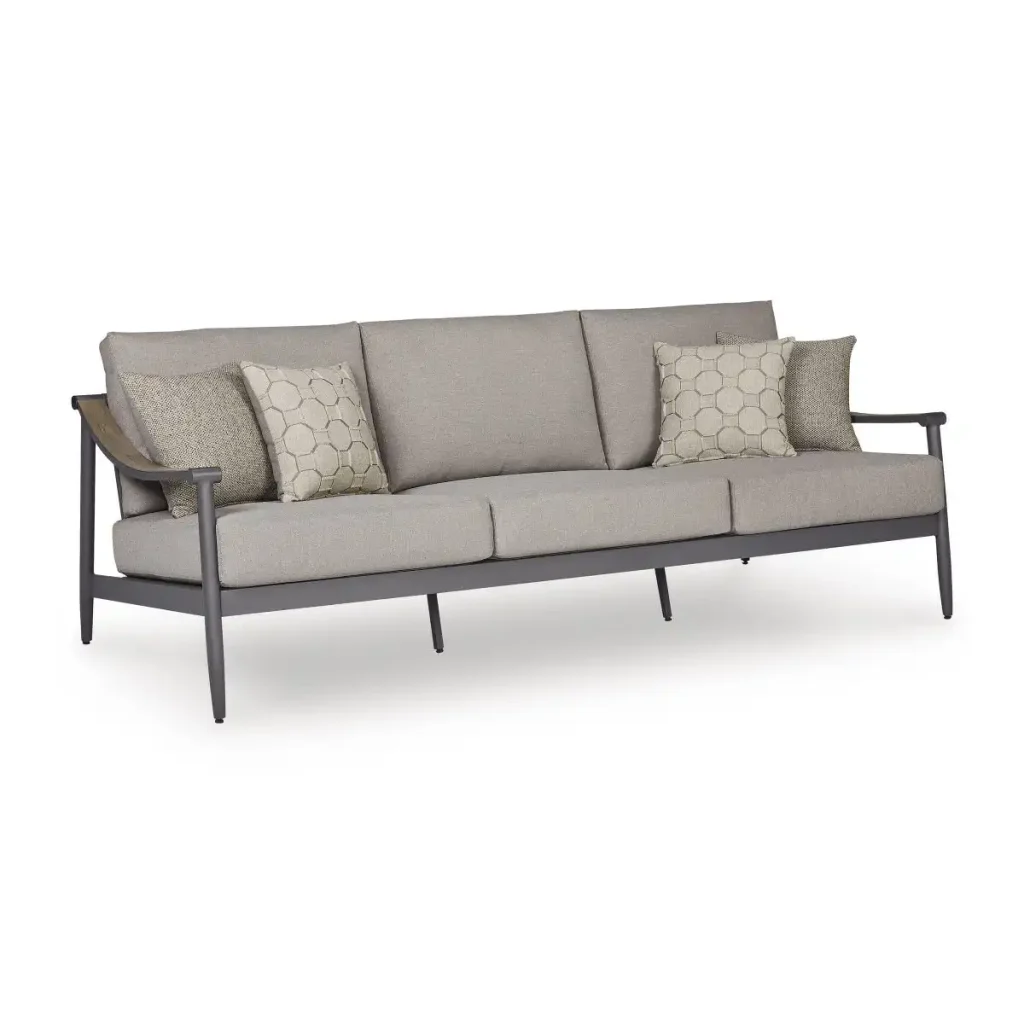 Three-quarter angle view of Akcay gray aluminum outdoor sofa showing wood-tone armrest accent, aluminum frame legs, and cushion depth