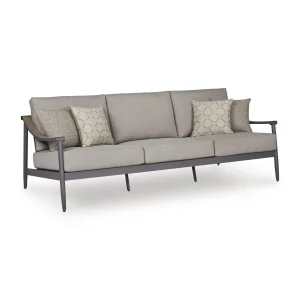 Three-quarter angle view of Akcay gray aluminum outdoor sofa showing wood-tone armrest accent, aluminum frame legs, and cushion depth
