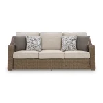 Front view of Antalya beige 3 seater outdoor sofa with brown wicker frame, beige cushions and decorative throw pillows
