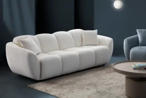 A modern white boucle sofa with a curved arm sofa design in a contemporary living room setting.