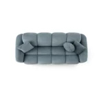A modern ice gray boucle sofa with a curved sofa design, in an elegant living room setting.