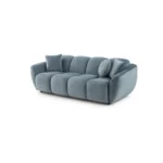 A modern ice gray boucle sofa with a curved sofa design, in an elegant living room setting.