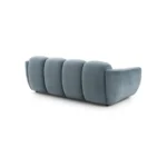 A modern ice gray boucle sofa with a curved sofa design, in an elegant living room setting.