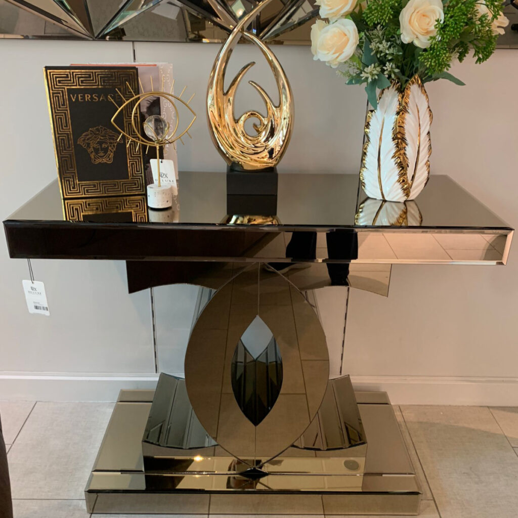 Bronze-tinted mirrored console table with luxurious design, perfect for entryways and living rooms.