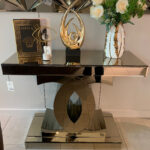 Bronze-tinted mirrored console table with luxurious design, perfect for entryways and living rooms.