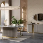 A contemporary beige and gold dining room set with an oval table, velvet chairs, and a fluted sideboard in a stylish room.