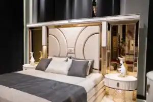 beige upholstered bed with black and gold accents – modern luxury bedroom set Tampa