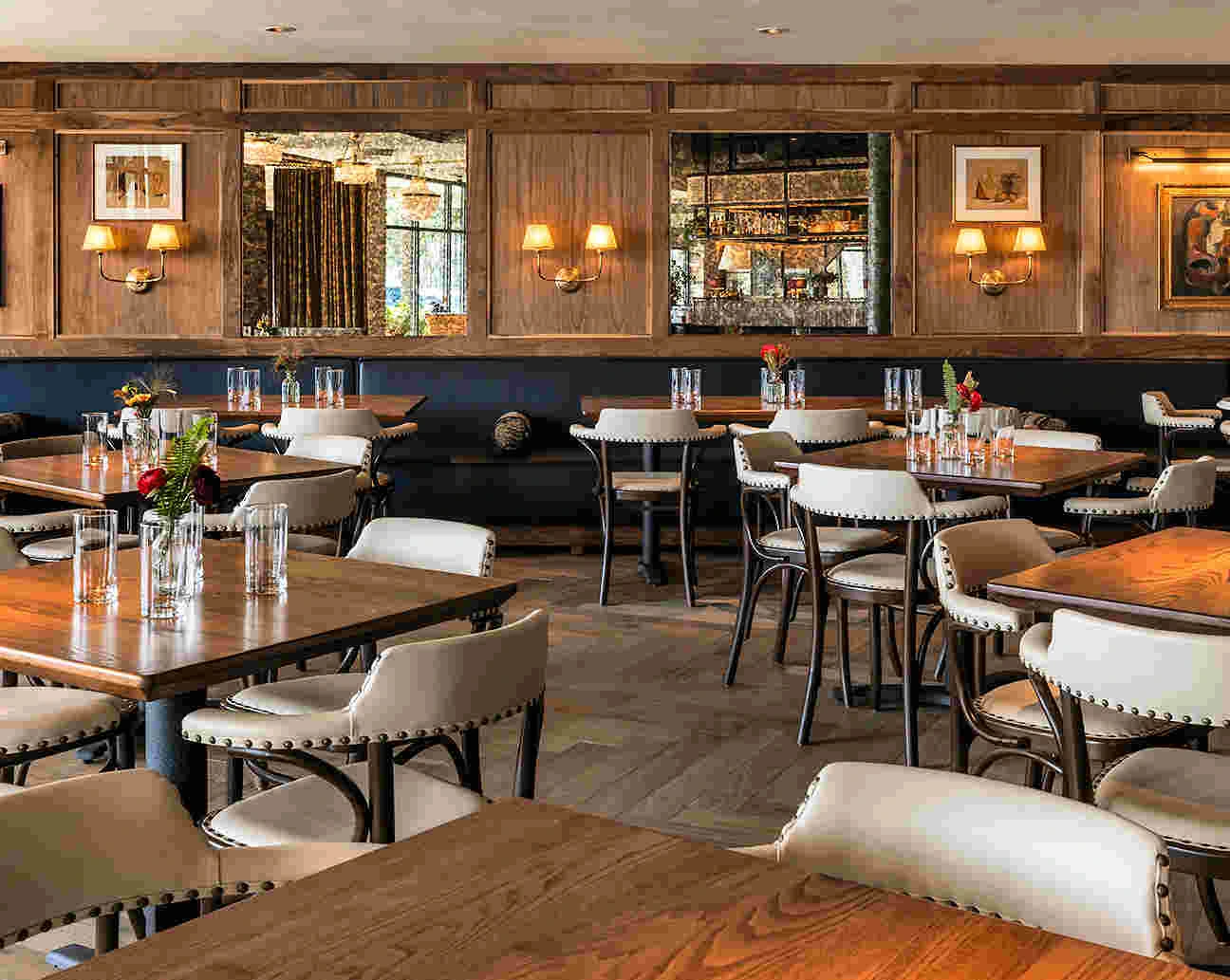 Luxury custom restaurant furniture for hospitality projects in Tampa, featuring professional-grade dining tables and leather chairs by Deluxe Home Decor & Furniture.