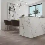 Modern kitchen island covered with Carrara white PVC marble sheet featuring elegant gray veining.