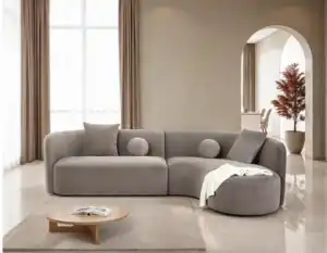 A contemporary Revello sectional sofa in light brown chenille with a curved design and accent pillows.