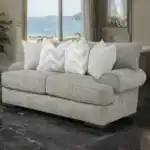Nerone Light Gray Loveseat with oversized cushions and roll arms in a transitional coastal living room.
