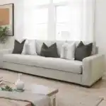 Romsey Light Gray Sofa with track arms and accent pillows in a bright transitional living room.