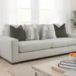 Romsey Light Gray Loveseat with track arms and accent pillows in a modern bright living room.