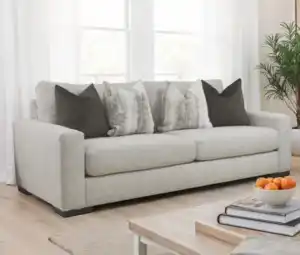 Romsey Light Gray Loveseat with track arms and accent pillows in a modern bright living room.