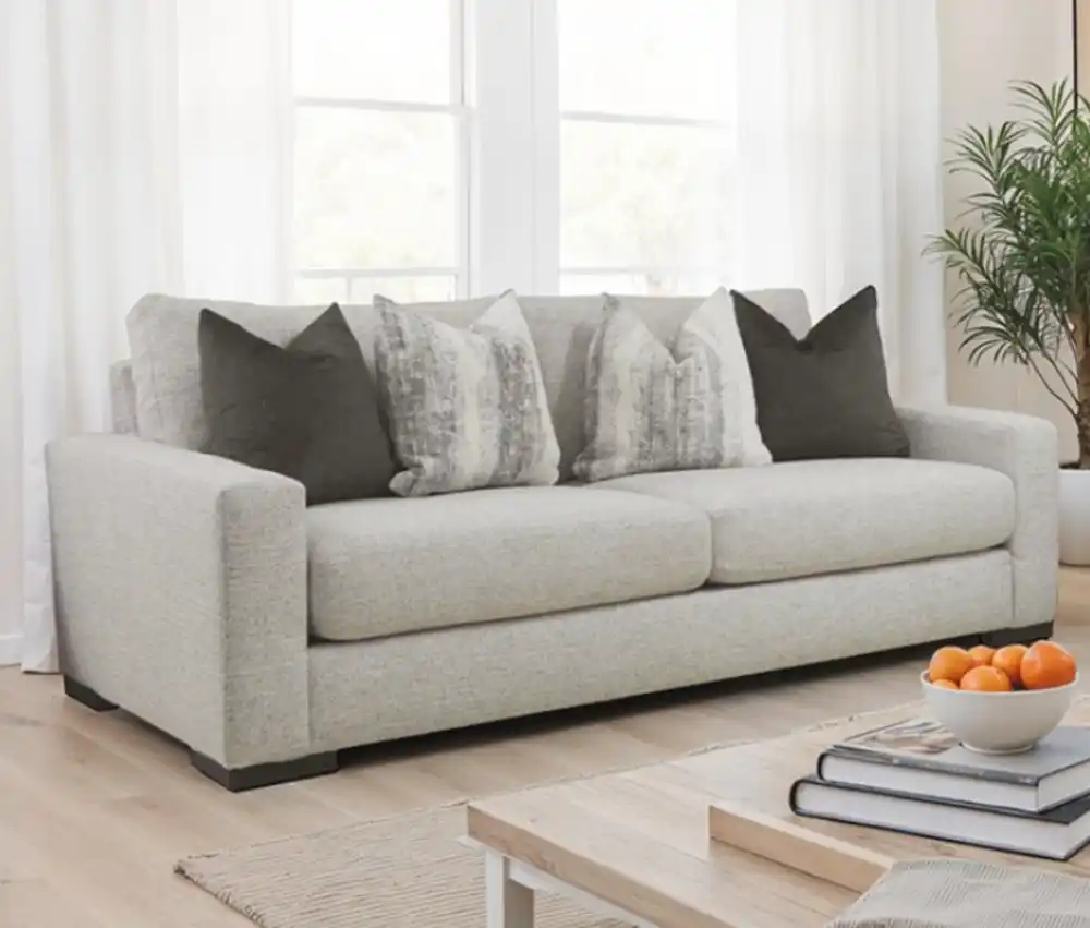 Romsey Light Gray Loveseat with track arms and accent pillows in a modern bright living room.