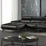 Vadso Black Sectional Sofa left chaise, contemporary black leather sofa with adjustable headrests in a Tampa modern living room.