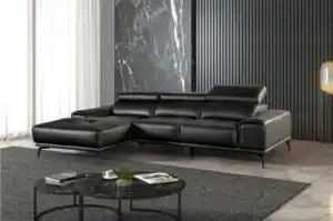Modern Vadso Black Leather Sectional Sofa left chaise, sleek black design with metal legs, displayed in Tampa furniture store.