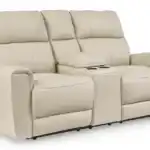 Dahlmoore Power Reclining Loveseat in almond-tone top grain leather, featuring a closed center console with cup holders. Modern furniture available at furniture stores Tampa.