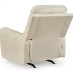 Back view of the Dahlmoore Power Rocker Recliner in almond leather, showing the durable construction, matched faux leather exterior, and the gentle rocking base mechanism.