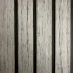 Wood looking silver gray PVC wall panel with black fluted channels, modern decorative interior wall solution.