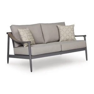 Three-quarter angle view of Akcay gray aluminum outdoor loveseat with wood-tone armrest accent and hexagon throw pillows