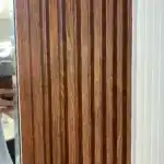 close up of walnut fluted wpc wall panel tampa decorative wall design