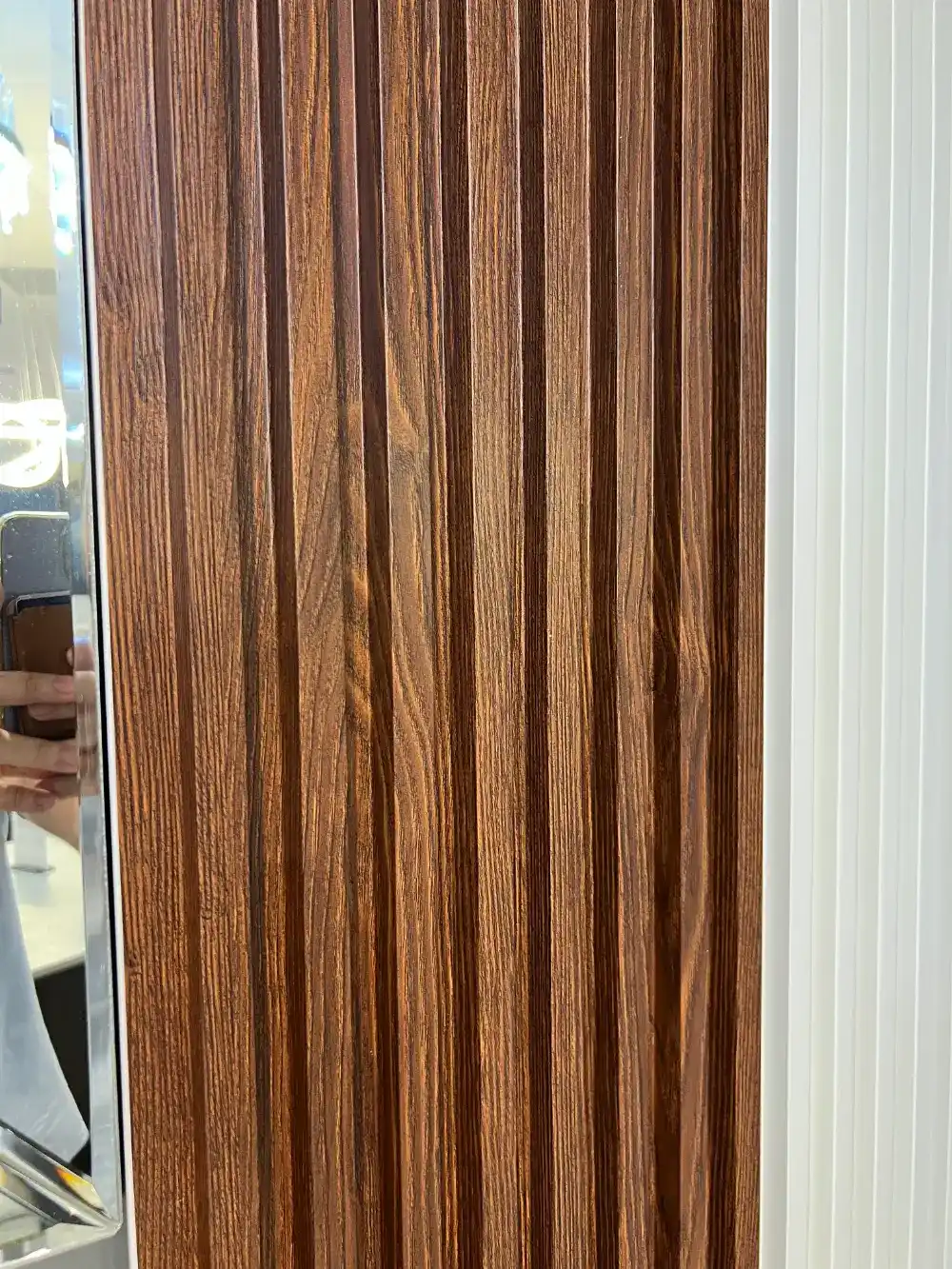 close up of walnut fluted wpc wall panel tampa decorative wall design