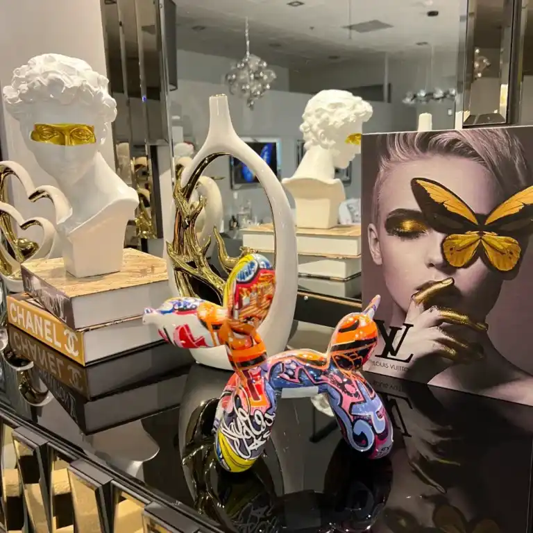 Mixed modern home accessories including vases, candle holders, and sculptures in Tampa showroom