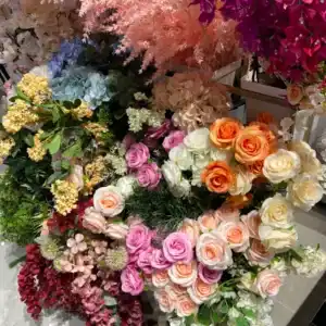 Wide selection of colorful faux flowers and greenery, including pink roses, white hydrangeas, and yellow accents. Premium home accessories available at the home decor store in Tampa, FL for styling and gifting.