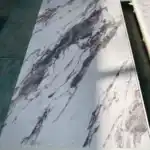 Calacatta Viola PVC marble sheet with bold purple veins and luxury marble effect design for modern wall and furniture applications.