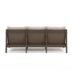 Straight back view of Patara beige outdoor sofa displaying three handwoven wicker panels framed by dark brown acacia wood