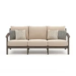Front view of Patara acacia wood outdoor sofa with beige cushions, dark brown wood frame, and decorative throw pillows on white background