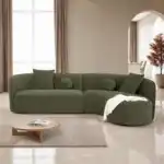 contemporary sectional sofa in olive green chenille with a curved design and accent pillows.