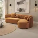 Revello Caramel Brown Sectional Sofa with Curved Design and Accent Pillows in a Contemporary Living Room