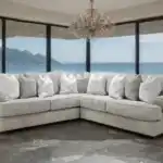 Transitional Nerone Gray Sectional Sofa with roll arms and accent pillows in a luxury living room setup.